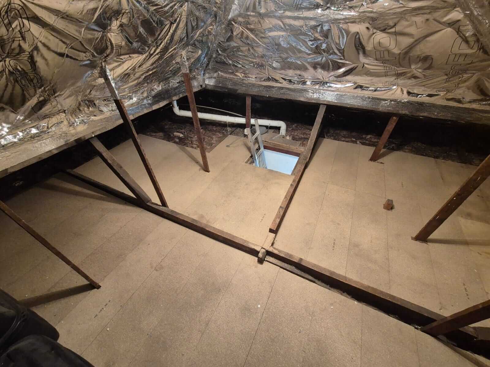 Loft boarding raised above insulation for storage